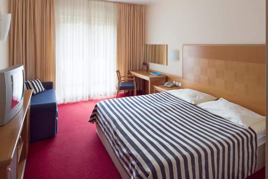 Ramada Hotel & Suites Kranjska Gora Quarto foto